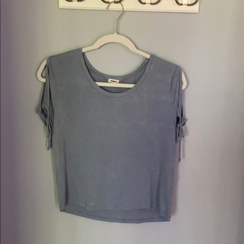 Blue-grey top with split shoulders.